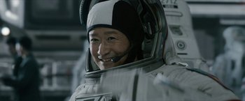 Movie still from “The Wandering Earth II” (2023), directed by Frant Gwo – A man in a spacesuit smiles for the camera; Close Up shot, Low angle