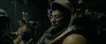 Movie still from “The Wandering Earth II” (2023), directed by Frant Gwo – A man in a space suit with a helmet on; Close Up shot, Over the shoulder angle