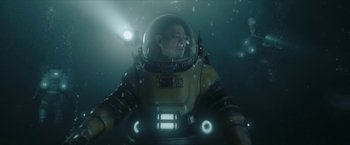 Movie still from “The Wandering Earth II” (2023), directed by Frant Gwo – A man in a space suit in the water; Medium shot, Low angle