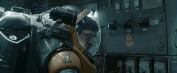 Movie still from “The Wandering Earth II” (2023), directed by Frant Gwo – A man wearing a helmet and glasses in a space suit; Medium shot, Low angle
