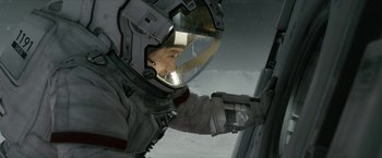 Movie still from “The Wandering Earth II” (2023), directed by Frant Gwo – A man in a spacesuit looking out of a window; Medium shot, Low angle