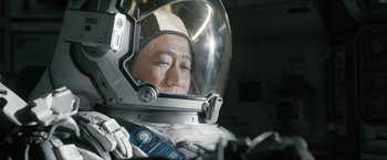 Movie still from “The Wandering Earth II” (2023), directed by Frant Gwo – A man in a space suit and a helmet; Close Up shot, Overhead angle