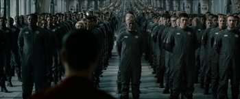 Movie still from “The Wandering Earth II” (2023), directed by Frant Gwo – A group of men in black uniforms standing in a line; Wide shot, Over the shoulder angle