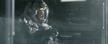 Movie still from “The Wandering Earth II” (2023), directed by Frant Gwo – A man in a spacesuit is sitting in a space station; Medium shot, Low angle