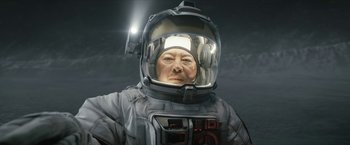 Movie still from “The Wandering Earth II” (2023), directed by Frant Gwo – A man in a spacesuit with a helmet on his head; Close Up shot, Overhead angle