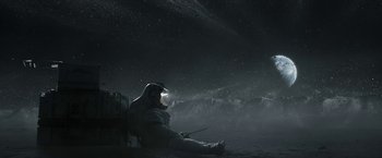 Movie still from “The Wandering Earth II” (2023), directed by Frant Gwo – A person sitting in the snow wearing a space suit; Extreme Wide shot, Overhead angle