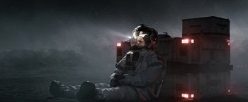 Movie still from “The Wandering Earth II” (2023), directed by Frant Gwo – A man in a space suit sitting on the ground; Wide shot, Overhead angle