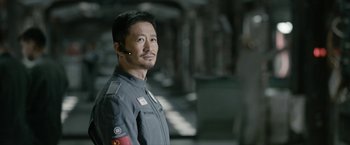 Movie still from “The Wandering Earth II” (2023), directed by Frant Gwo – A man in a uniform is looking at the camera; Close Up shot, Over the shoulder angle