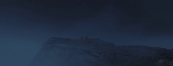 Movie still from “The Wanting Mare” (2020), directed by Nicholas Ashe Bateman – Two people sitting on top of a hill at night; Extreme Wide shot, Low angle