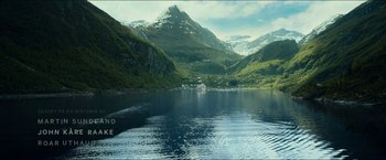 Movie still from “The Wave” (2015), directed by Roar Uthaug – A large body of water surrounded by mountains; Extreme Wide shot, High angle