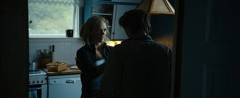 Movie still from “The Wave” (2015), directed by Roar Uthaug – Two people standing in a kitchen talking to each other; Medium shot, Over the shoulder angle