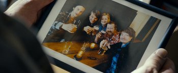 Movie still from “The Wave” (2015), directed by Roar Uthaug – A group of people sitting at a table with drinks; Extreme Close Up shot, Overhead angle