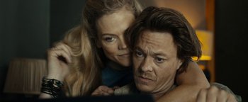 Movie still from “The Wave” (2015), directed by Roar Uthaug – A man and a woman looking at the camera; Close Up shot, Over the shoulder angle