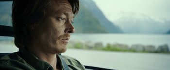 Movie still from “The Wave” (2015), directed by Roar Uthaug – A person looking out of a car window; Close Up shot, High angle