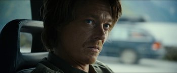 Movie still from “The Wave” (2015), directed by Roar Uthaug – A person with long hair and blue eyes; Close Up shot, Over the shoulder angle