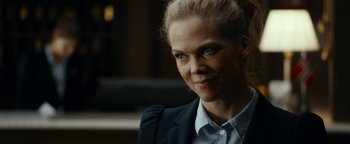 Movie still from “The Wave” (2015), directed by Roar Uthaug – A person wearing a suit; Close Up shot, Over the shoulder angle