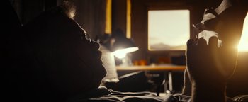 Movie still from “The Wave” (2015), directed by Roar Uthaug – A man is laying down with his eyes closed; Close Up shot, Low angle