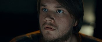 Movie still from “The Wave” (2015), directed by Roar Uthaug – A person with blue eyes; Close Up shot, Over the shoulder angle
