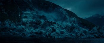 Movie still from “The Wave” (2015), directed by Roar Uthaug – A large body of water with waves crashing on it; Extreme Wide shot, High angle