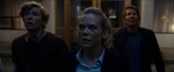 Movie still from “The Wave” (2015), directed by Roar Uthaug – A person wearing a jacket; Close Up shot, Over the shoulder angle