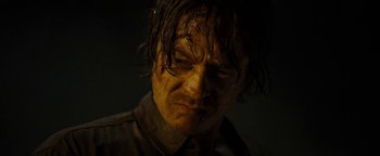 Movie still from “The Wave” (2015), directed by Roar Uthaug – A person wearing a brown shirt; Close Up shot, Over the shoulder angle