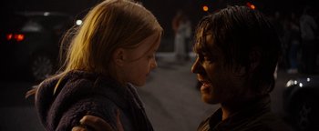 Movie still from “The Wave” (2015), directed by Roar Uthaug – A man and a little girl face to face; Close Up shot, Over the shoulder angle