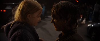 Movie still from “The Wave” (2015), directed by Roar Uthaug – A man and a woman face to face on the street; Close Up shot, Over the shoulder angle