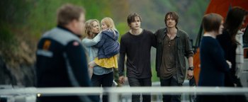 Movie still from “The Wave” (2015), directed by Roar Uthaug – A group of young people walking on a bridge; Medium shot, Over the shoulder angle
