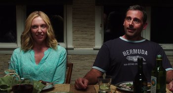 Movie still from “The Way Way Back” (2013), directed by Jim Rash – A man and a woman sitting at a dinner table; Medium shot, Over the shoulder angle