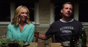 Movie still from “The Way Way Back” (2013), directed by Jim Rash – A man and a woman sitting at a dinner table; Medium shot, Over the shoulder angle