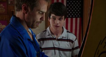 Movie still from “The Way Way Back” (2013), directed by Jim Rash – A man and a young boy looking at a tablet computer; Close Up shot, Over the shoulder angle