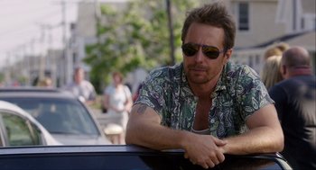 Movie still from “The Way Way Back” (2013), directed by Jim Rash – A man leaning on the side of a car; Close Up shot, Over the shoulder angle