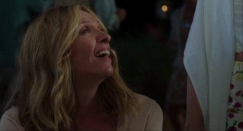 Movie still from “The Way Way Back” (2013), directed by Jim Rash – A person with a smile on their face; Close Up shot, Over the shoulder angle