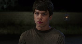Movie still from “The Way Way Back” (2013), directed by Jim Rash – A young man is looking into the distance; Close Up shot, Over the shoulder angle