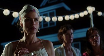 Movie still from “The Way Way Back” (2013), directed by Jim Rash – Two women standing in front of a string of lights; Close Up shot, Low angle