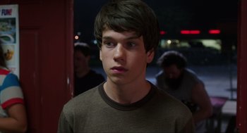 Movie still from “The Way Way Back” (2013), directed by Jim Rash – A young man is looking into the distance; Close Up shot, Over the shoulder angle