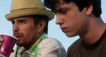 Movie still from “The Way Way Back” (2013), directed by Jim Rash – Two young men standing next to each other; Close Up shot, Over the shoulder angle