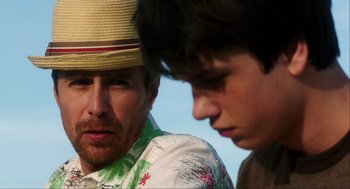 Movie still from “The Way Way Back” (2013), directed by Jim Rash – A man and a boy are looking at one another; Close Up shot, Over the shoulder angle