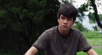 Movie still from “The Way Way Back” (2013), directed by Jim Rash – A young man is looking into the distance; Close Up shot, Over the shoulder angle