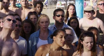 Movie still from “The Way Way Back” (2013), directed by Jim Rash – A group of people that are standing in the water; Medium shot, High angle
