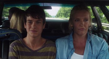 Movie still from “The Way Way Back” (2013), directed by Jim Rash – A woman and a boy sitting in the back seat of a car; Close Up shot, Over the shoulder angle