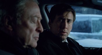Movie still from “The Weather Man” (2005), directed by Gore Verbinski – Two men sitting in the back seat of a car; Close Up shot, Over the shoulder angle