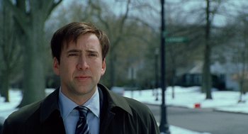 Movie still from “The Weather Man” (2005), directed by Gore Verbinski – A person wearing a suit and tie; Close Up shot, Low angle