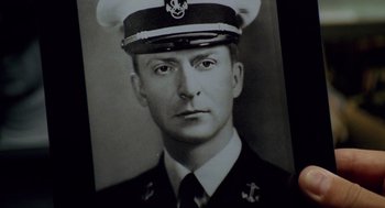 Movie still from “The Weather Man” (2005), directed by Gore Verbinski – An old black and white photo of a man in a military uniform; Close Up shot, High angle