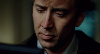 Movie still from “The Weather Man” (2005), directed by Gore Verbinski – A person wearing a suit and tie; Close Up shot, Low angle