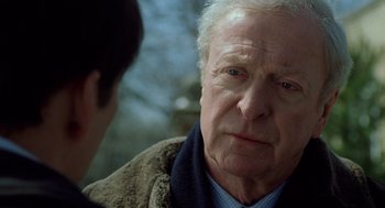 Movie still from “The Weather Man” (2005), directed by Gore Verbinski – An older man is looking at a younger man; Close Up shot, Over the shoulder angle