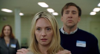 Movie still from “The Weather Man” (2005), directed by Gore Verbinski – A woman and a man standing next to each other in a room; Close Up shot, Over the shoulder angle