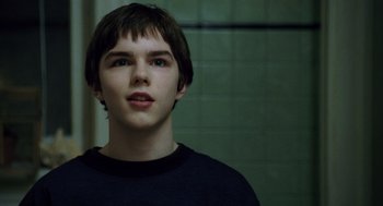 Movie still from “The Weather Man” (2005), directed by Gore Verbinski – A young man is looking into the camera; Close Up shot, Over the shoulder angle