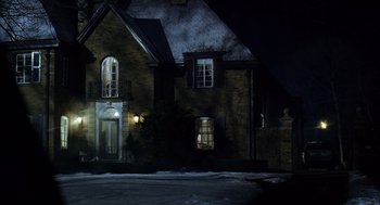 Movie still from “The Weather Man” (2005), directed by Gore Verbinski – A house that is lit up at night time; Extreme Wide shot, High angle