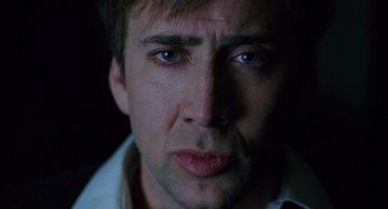 Movie still from “The Weather Man” (2005), directed by Gore Verbinski – A man's face in the dark; Close Up shot, Low angle